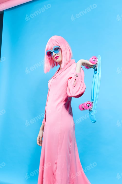 Preview: portrait of a woman fashion blue glasses skateboard studio model unaltered
