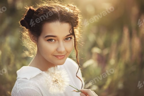 Preview: Beautiful carefree woman in fields being happy outdoors