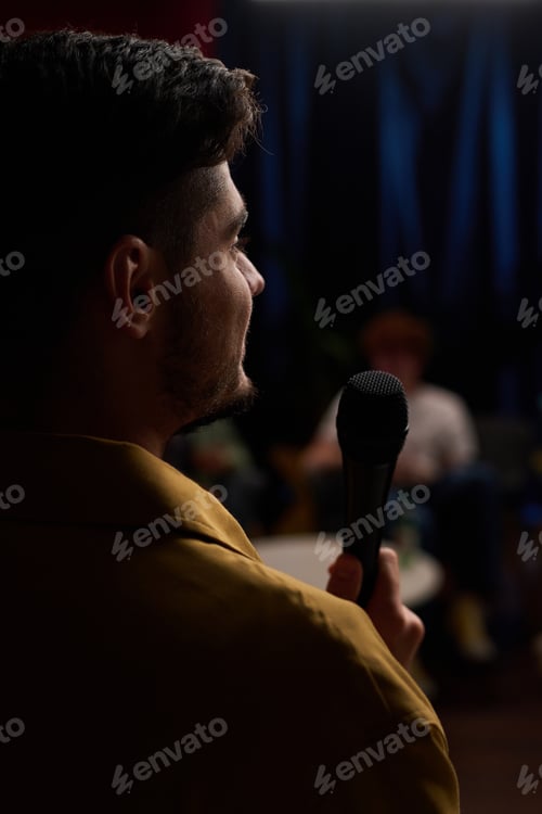 Preview: Presenting Speech On Stage Holding Microphone