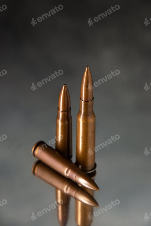 Preview: front view of brown bullets on gray background gun tanks death war shooting