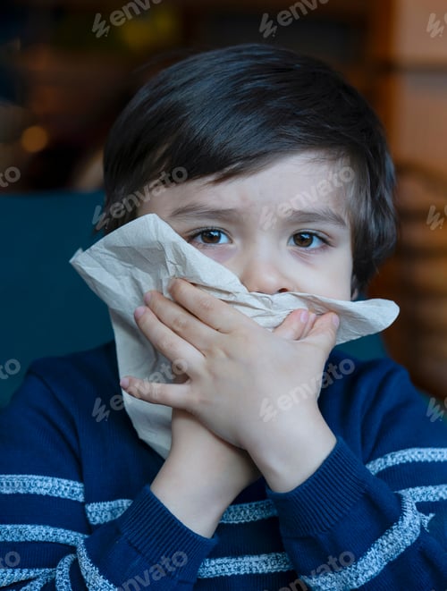 Preview: Kid boy wipes his mouth with napkin, child wiping his mouth after finished eating