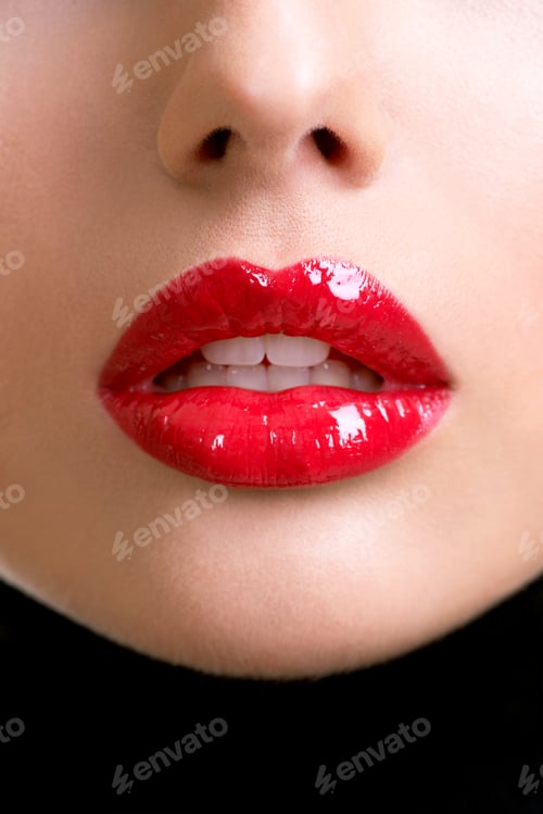 Preview: Closeup beautiful female lips with red lipstick.