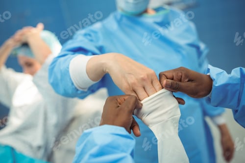 Preview: Medical Professionals Preparing in Operating Room Environment