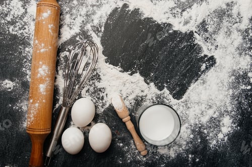 Preview: Pasta ingredients on a wooden kitchen table. Top view with space for text