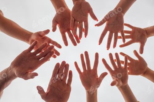 Preview: Female and male hands on a white background. The arms of men and women in a circle