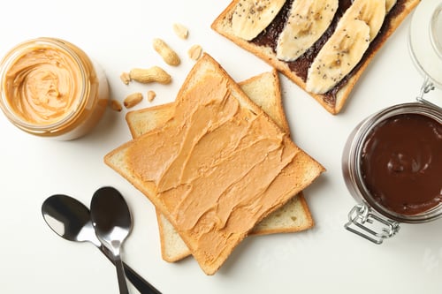 Preview: Concept of breakfast with toasts with peanut butter and chocolate