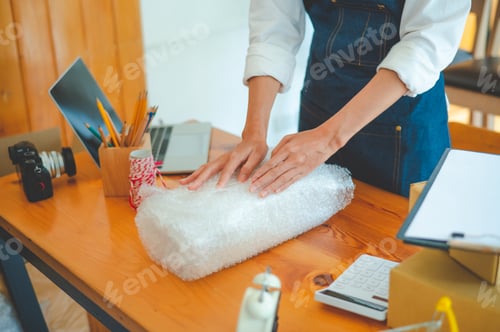 Preview: Online small business owners are packing their ordered products into the boxes
