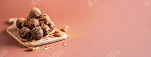 Preview: Homemade vegan chocolate truffles with dried fruits and nuts mix ingredients on wooden background