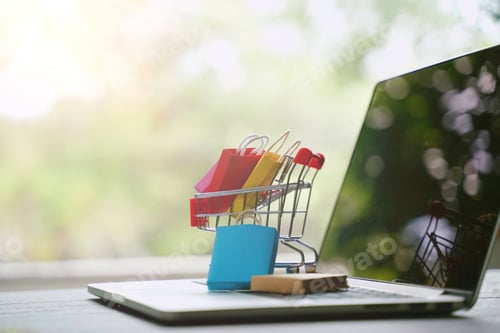 Preview: E-commerce shopping online concept,shopping bag in cart on laptop with copy space, black friday sale