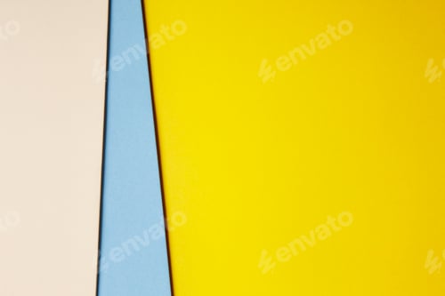 Preview: Colored cardboards background in beige blue yellow tone. Copy space. Horizontal