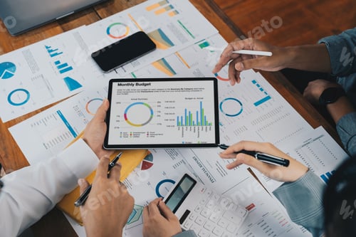 Preview: Close up business adviser partnership coworkers using a tablet to chart company financial