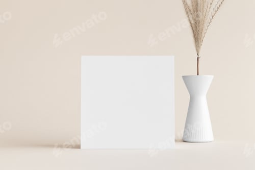 Preview: Square invitation card mockup with a pampas decoration on the soft yellow background.
