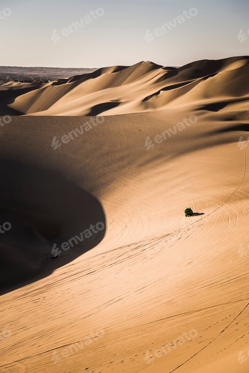 Preview: Dune buggying in sand dunes at sunset in the desert at Huacachina, Ica Region, Peru, South America