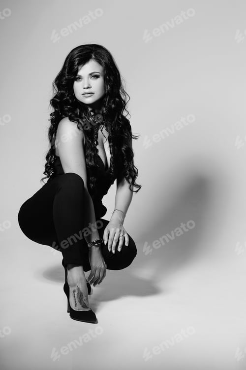 Preview: Black and white portrait of young model with long hair.