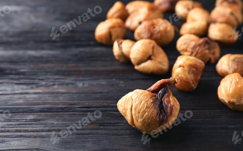 Preview: Delicious dried fig on wooden background, closeup. Space for text