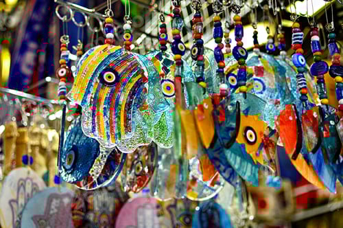 Preview: Closeup shot of hanging colorful traditional souvenirs at a store