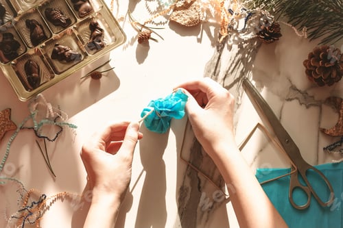 Preview: Teenage girl making handmade Christmas gift with chocolate sweets for New Year, Christmas holidays N