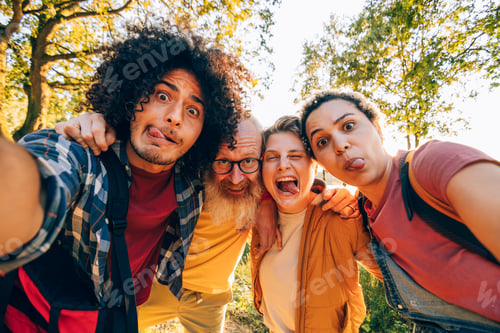 Preview: Hikers making funny faces and taking a selfie in the woods