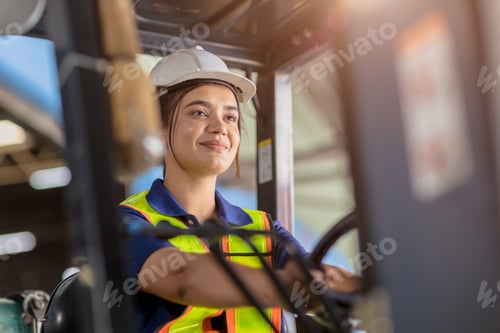 Preview: Indian woman worker warehouse forklift driver staff happy smiling enjoy working