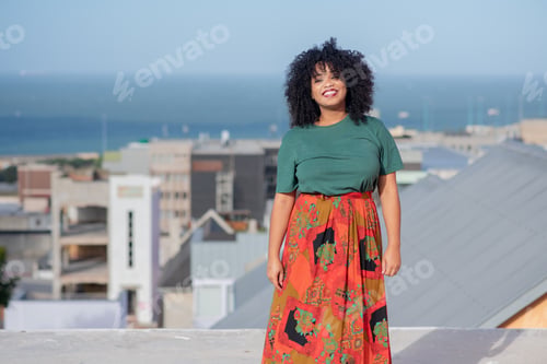 Preview: Portrait of beautiful woman standing on deck of house