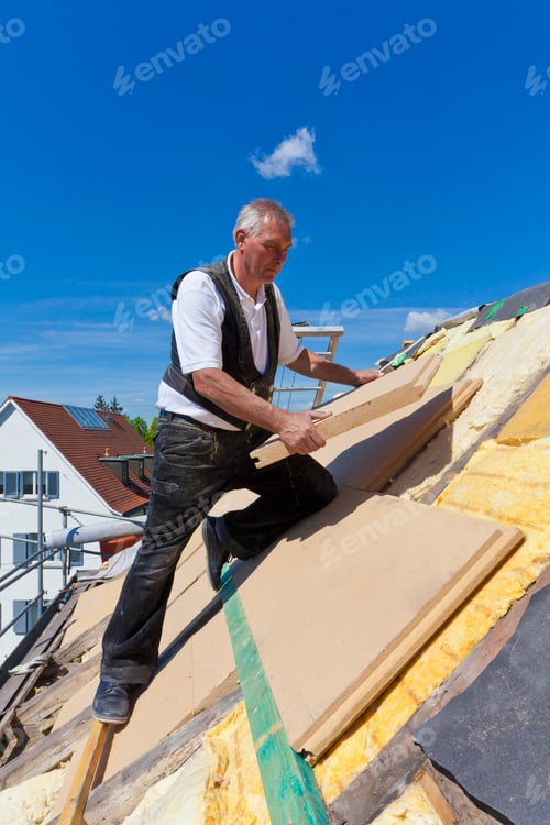 Preview: Germany, Baden-Wuerttemberg, Stuttgart, Mature man placing insulation