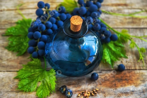 Preview: Grape seed oil in a bottle. Selective focus.
