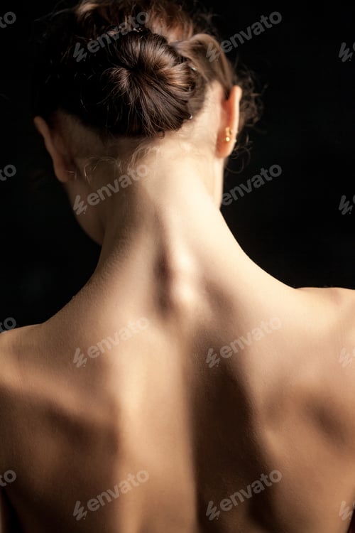 Preview: Beautiful woman, back view on dack background