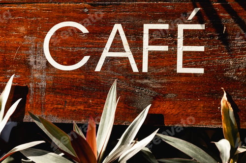 Preview: word CAFE is written on a wooden plank. It serves as a sign or a hanging board