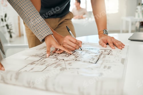 Preview: Businesspeople working on building plan together. Hands of colleagues writing on a blueprint. Two a