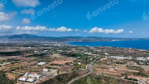 Preview: Aerial view of Taiwan coastal landscape featuring lush fields and distant mountains
