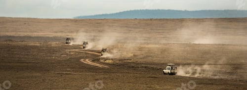 Preview: Safari jeeps crossing Serengeti, Tanzania, Africa