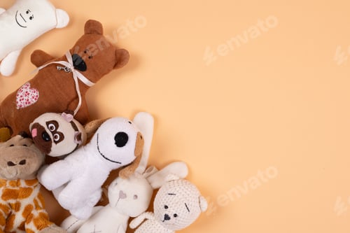 Plush Stuffed Animal Toys on Light Orange Background