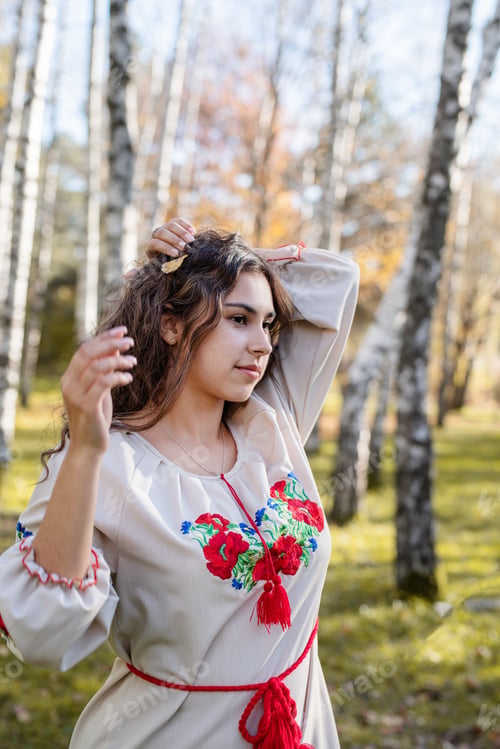 Preview: beautiful woman in ukrainian national traditional costume clothes in forest