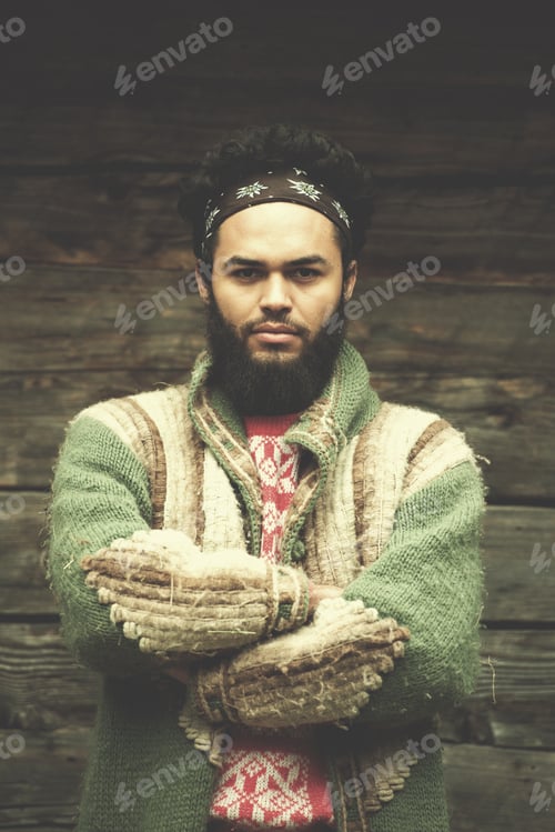 Preview: portrait of young hipster in front of wooden house