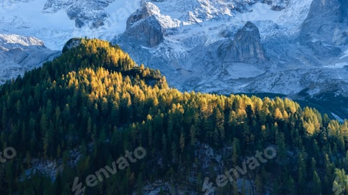 Preview: High sharp rocks and forest. Mountain valley before sunset. Natural landscape.