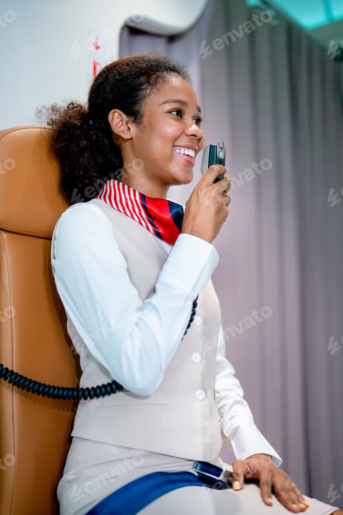 Preview: Air hostess or airline staff sit on cabin crew seat and use microphone of airplane to give