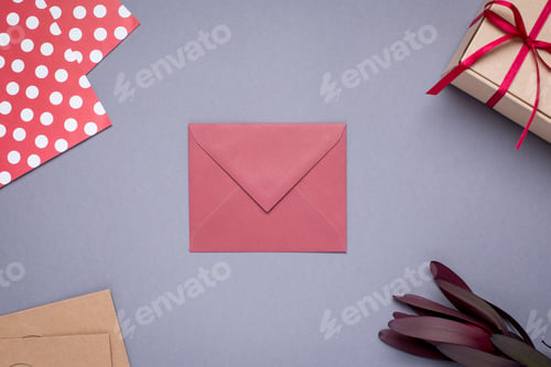 Preview: Present card and gift in box with satin ribbon on gray background