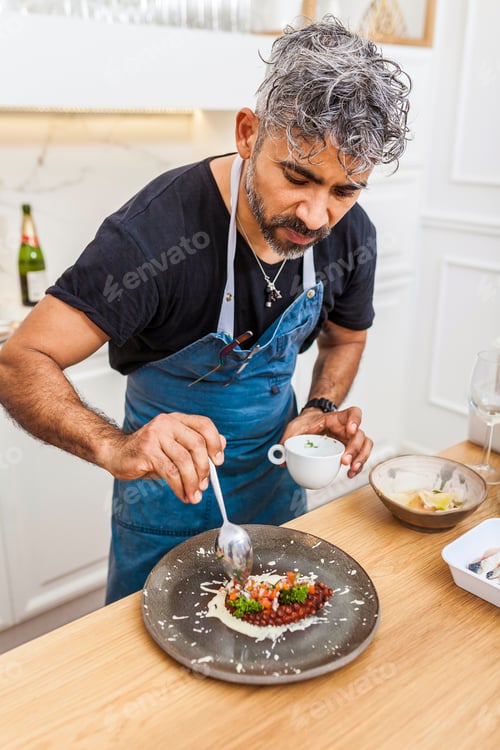 Preview: Latin cook preparing octopus at private dinner at home