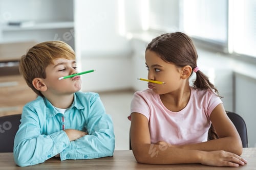 Preview: The funny boy and a girl playing at the desk