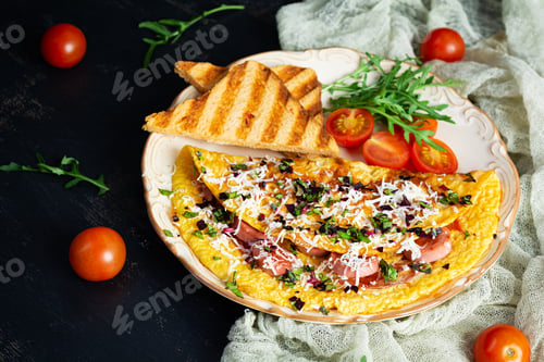 Preview: Fried omelette stuffed with sausage, tomatoes, greens and cheese. Delicious easy breakfast