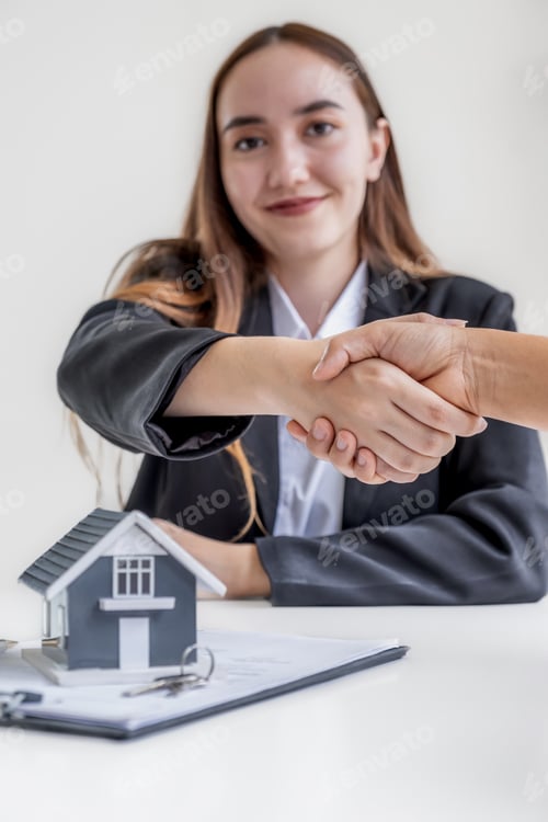 Preview: Real estate agents sale broker and buyers handshake after signing a business contract at home office