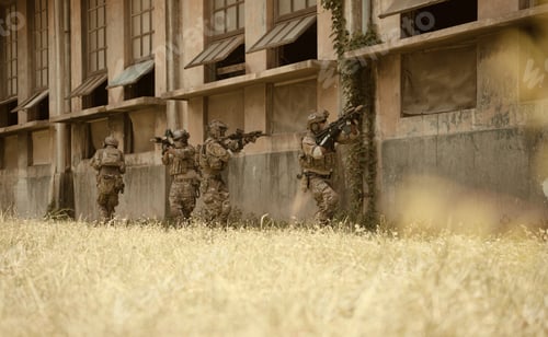 Preview: Professional marine soldiers training with weapon on a military range.