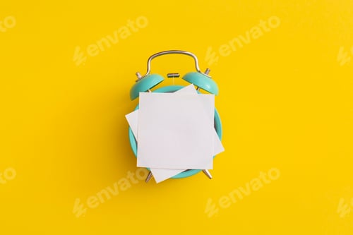 Preview: Antique alarm clock on a yellow background.