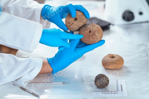 Preview: Archeology Scientists Analyzing Ancient Weight in Laboratory