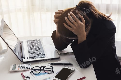 Preview: Stressed and frustrated asian business woman