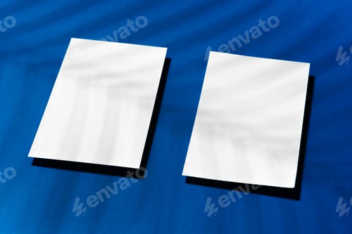 Preview: Two stacks of blank businesscards on blue background