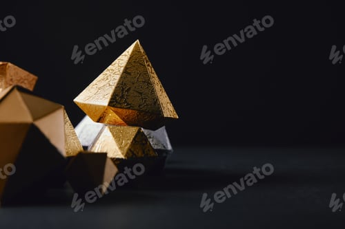 Preview: cose-up view of shiny faceted glittering gold pieces on black background