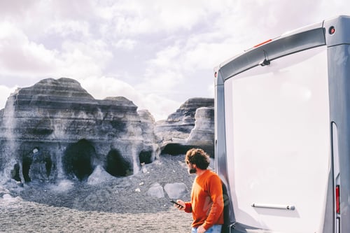 Preview: Travel with camper van and scenic destination. One man enjoy outdoors beauty and nature