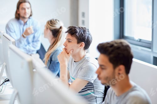 Preview: Students working on computers in higher education college computer room