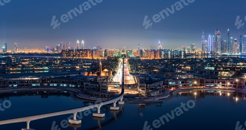 Preview: Cityscape of Dubai, United Arab Emirates at dusk, with illuminated skyscrapers in the distance and